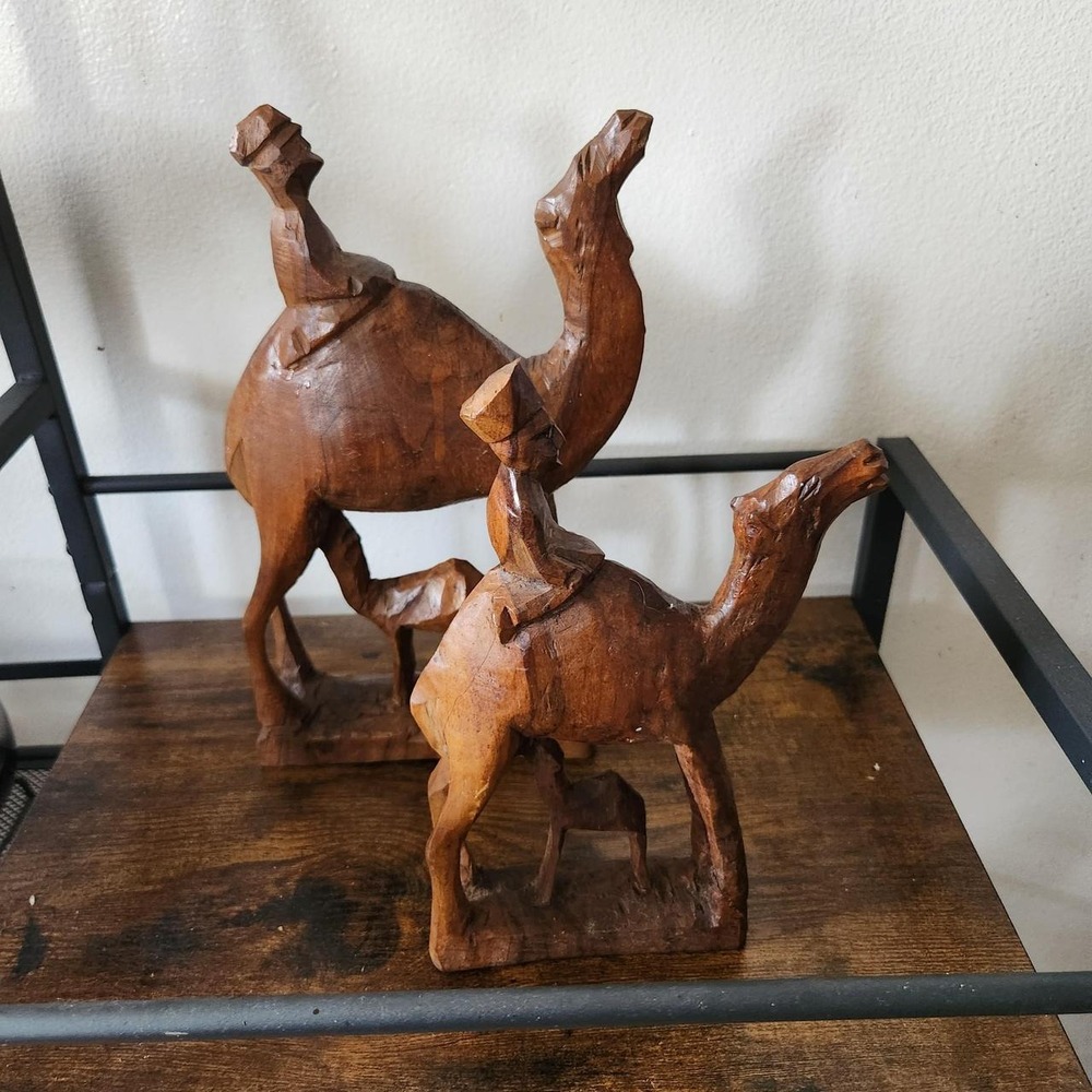 Set of two hand-carved wooden camel figurines